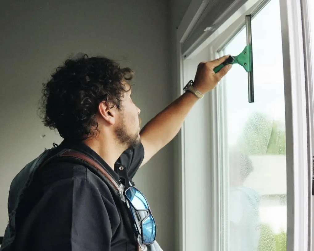 recurring 2 Technician using a squeegee on interior residential glass during a recurring cleaning service in Edgewood WA